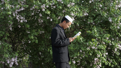 A Muslim student from the Chinese Hui minority studies at Ningxia Islamic College in Yinchuan, capital of northwest China's Ningxia Hui Autonomous Region, April 23,2007. According to school and local sources, more than 300 students, including 82 girls, learn culture, Arabic language, Islam and history at the college, which was founded in 1989.