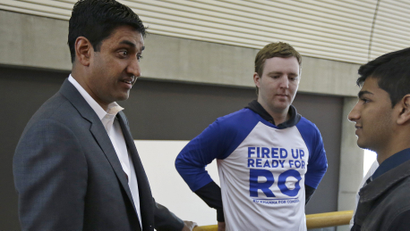 Ro Khanna, left, Democratic candidate for U.S. Representative from California's 17th District, speaks with supporters during a break in the California Democrats State Convention Saturday, Feb. 27, 2016, in San Jose, Calif. (AP Photo/)