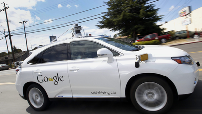 Google's self-driving Lexus drives along a street in Mountain View, California.