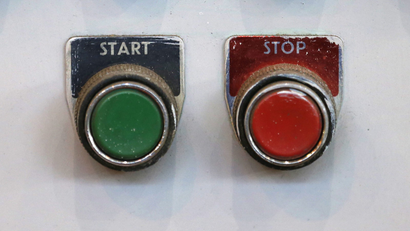 Start and stop buttons are seen in the turbine hall inside EDF Energy's Hinkley Point B Power Station.