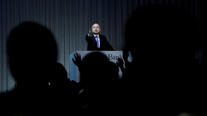 FILE PHOTO: Journalists raise their hands to ask questions to Japan's SoftBank Group Corp Chief Executive Masayoshi Son during a news conference in Tokyo