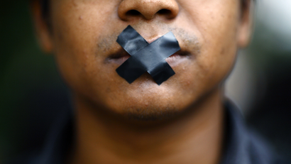 Man with mouth taped