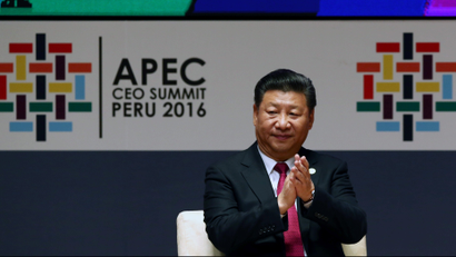 China's President Xi Jinping applauds while attending a meeting of the APEC (Asia-Pacific Economic Cooperation) Ceo Summit in Lima, Peru, November 19, 2016.