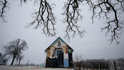 A barn decorated with a mural inspired by Grant Wood's painting, "American Gothic," is seen in Mt. Vernon, Iowa, January 25, 2015. Artist Mark Benesh recreated the original which was painted by Grant Wood.