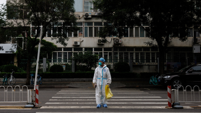 A medical worker in a protective suit in Beijing, China.