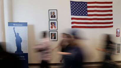 People make their way to a naturalization ceremony at a U.S. Citizenship and Immigration Services office Monday, Jan. 28, 2013, in Irving, Texas.