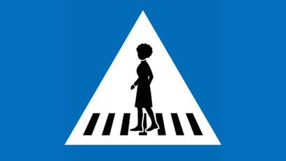 Geneva's new pedestrian crossing sign featuring a woman with an Afro