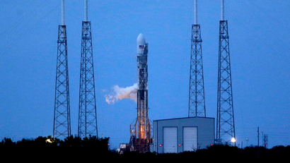 A Falcon 9 SpaceX rocket sits on Launch Complex 40 just before the launch window opened at the Cape Canaveral Air Force Station in Cape Canaveral, Fla., Monday, Nov. 25, 2013. The launch was scrubbed near the end of the launch window and will be rescheduled.