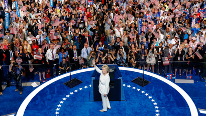 Democratic presidential nominee Hillary Clinton turns a waves at delegates before speaking during the final day of the Democratic National Convention in Philadelphia , Thursday, July 28, 2016