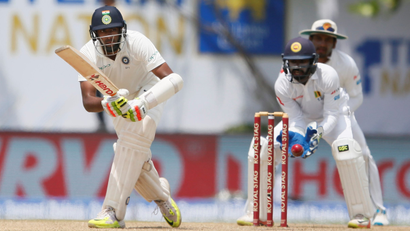 Ravichandran Ashwin plays a shot in a test cricket game