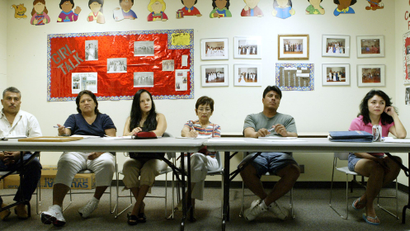 Students attend an English as a Second Language or ESL class at the Douglas Community Center June 8, 2006, in Plano, Texas. The Dallas suburbs of Plano, Irving, Carrollton and Farmers Branch along with other Texas cities have reported putting people on wait lists for ESL classes. Programs all over the country face the same.
