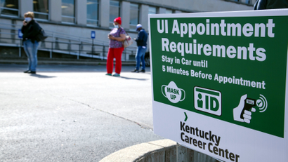 People wait in line as Kentucky Labor Cabinet reopens 13 Regional Career Centers for in-person unemployment insurance services, in Louisville, Kentucky, U.S.