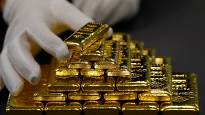 An employee sorts gold bars in the Austrian Gold and Silver Separating Plant 'Oegussa' in Vienna.