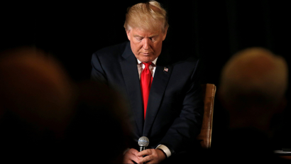 Republican presidential nominee Donald Trump pauses before answering questions at the "Retired American Warriors" conference during a campaign stop in Herndon