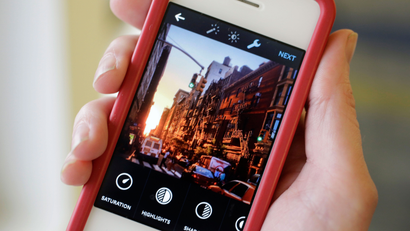 This Monday, June 9, 2014 photo shows the Instagram app, featuring new editing tools, on an iPhone posed for a photo in New York. Instagram, available for iOS 6.0 and later and Android phones, recently introduced 10 new editing tools. (AP Photo/Mark Lennihan)