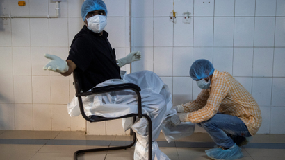 A doctor wears protective equipment in an Indian hospital