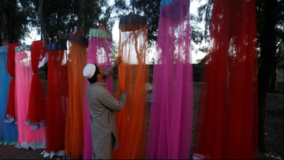 Colorful mosquito nets hang from