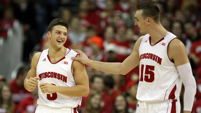 Wisconsin Badgers guard Zak Showalter (3) gets a pat on the shoulder from Wisconsin Badgers forward Sam Dekker (15) at the Kohl Center.