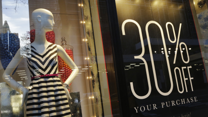 A 30 percent off sign is displayed in a Banana Republic store, Wednesday, Nov. 20, 2013 in New York.