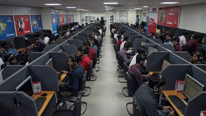 Employees of a private call centre hired by India's main opposition Congress party make calls to party workers in Jaipur