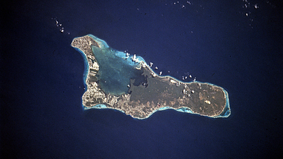 The island of Grand Cayman, a British dependency that covers 76 square miles (197 square kilometers) in the northwest Caribbean Sea, is visible in this near-vertical photograph. Geologically similar to The Bahamas, Grand Cayman is a low-lying, limestone island located on top of a submarine ridge. The city of George Town, the capital and chief port of the Cayman Islands, can be seen at the southwest end of the island. Grand Cayman’s 7-mile beach can be seen on the western side of the island.