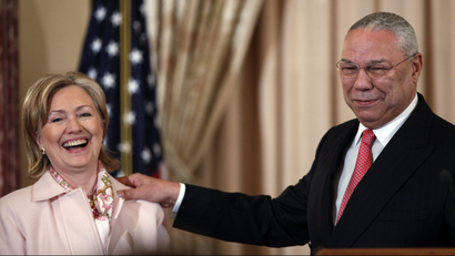 Former Secretary of State Colin Powell shares a laugh with then Secretary of State Hillary Rodham in 2009