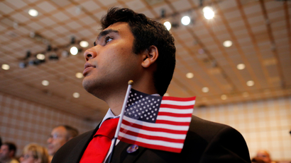 An Indian man being sworn in as a US citizen.