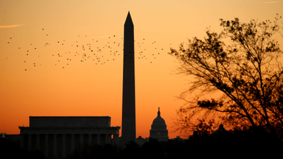 An orange sky over the Washington Monument and the Capitol building in Washington, DC