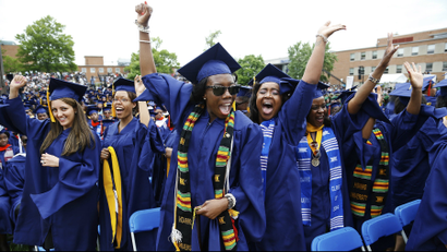 Graduates celebrate during the 2014 graduation ceremonies at Howard University in Washington, DC.