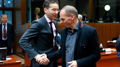 Dutch Finance Minister and Eurogroup chairman Jeroen Dijsselbloem shakes hands with Greek Finance Minister Yanis Varoufakis (R) during an European Union finance ministers meeting in Brussels February 17, 2015. The European Union will continue working on Greece's debt problems to achieve "a very good outcome" for average Europeans, Varoufakis said on Tuesday.