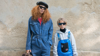 PARIS, FRANCE - SEPTEMBER 26 : Jewellery designer Natasha Zinko wears a Dior jumpsuit, Celine sunglasses and Natasha Zinko bag and jewellery with Ivan Zinko wears a DIY jumpsuit, Dior x Rihanna sunglasses, Prada turtleneck sweater, Champion hooded top day 1 of Paris Womens Fashion Week Spring/Summer 2018, on September 26, 2017 in London, England. (Photo by Kirstin Sinclair/Getty Images)