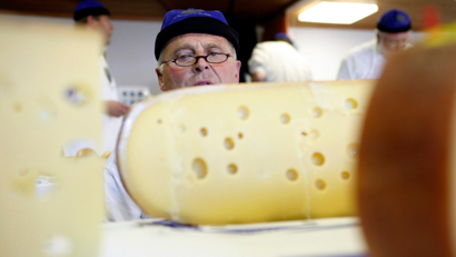 A jury member tests cheese during the Fifth Swiss Cheese Award event run by Fromarte, an organisation of Swiss cheese makers, in Affoltern, Switzerland, Thursday, Oct. 26, 2006. All together 435 different kinds of cheese run in the competition.