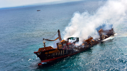 Smoke rises from a fire onboard the MV X-Press Pearl vessel as it sinks