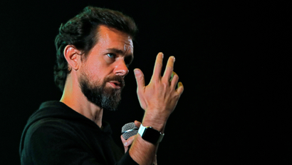 Twitter CEO Jack Dorsey is attached to his Apple watch.