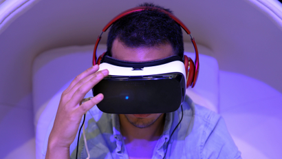 A man wears virtual reality glasses.