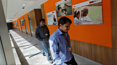 Employees walk inside Tech Mahindra office building in Noida