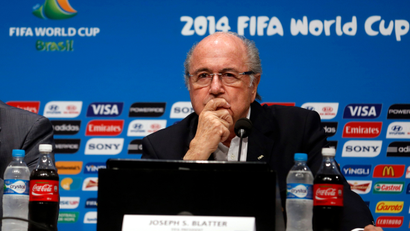 FIFA President Sepp Blatter (R) and Secretary General Jerome Valcke attend a news conference at the Maracana stadium in Rio de Janeiro July 14, 2014. Blatter gave the World Cup in Brazil 9.25 marks out of 10 on Monday, the day after the tournament ended with Germany beating Argentina 1-0 after extra time in the final.