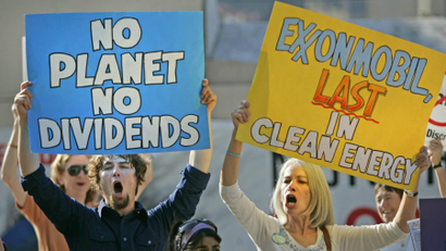 Protesters shout outside a 2006 ExxonMobil shareholders meeting.