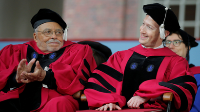 Actor James Earl Jones applauds after Facebook founder Mark Zuckerberg received an honorary Doctor of Laws degree during the 366th Commencement Exercises at Harvard University in Cambridge