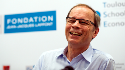 French economist Jean Tirole reacts as he speaks during a news conference at the Toulouse School of Economics in Toulouse October 13, 2014. French economist Jean Tirole won the 2014 economics Nobel Prize for his analysis of market power and regulation, the Royal Swedish Academy of Sciences said on Monday.