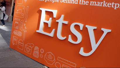 A sign advertising the online seller Etsy Inc. is seen outside the Nasdaq market site in Times Square