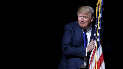 Donald Trump holds US flag