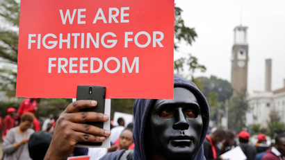 Kenyan activists and civil society groups protest in solidarity with Ugandan pop star-turned-lawmaker Kyagulanyi Ssentamu, also known as Bobi Wine, in a march to the Ugandan embassy in Nairobi, Kenya Thursday, Aug. 23, 2018. Bobi Wine, who opposes Uganda's longtime president Yoweri Museveni, was charged with treason in a civilian court in Gulu, Uganda on Thursday, minutes after a military court dropped weapons charges.