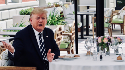 U.S. President Trump sits to lunch with French President Macron at Hotel du Palais in Biarritz.