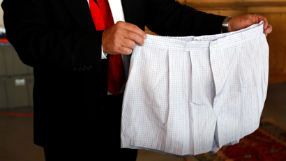 A pair of boxer shorts belonging to Bernard Madoff are displayed by an auctioneer during a media preview of the U.S. Marshals Service 'Madoff II Auction' in the Brooklyn borough of New York November 10, 2010. More than 400 pieces of personal property, jewelry, and antiques from Madoff and his wife, Ruth, will be sold at the auction in New York City on November 13, 2010. The property was forfeited and seized in connection with the criminal prosecution of Madoff by the United States Attorney's Office and the proceeds from the auction will be deposited in the United States Department of Justice Asset Forfeiture Fund to compensate the victims of the multi-billion dollar scam, according to a release from the U.S. Marshals Service.