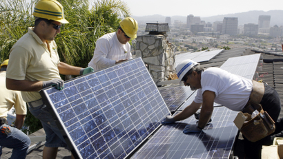 Solar panel installers at work