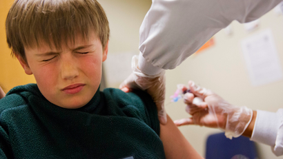 child getting a flu shot
