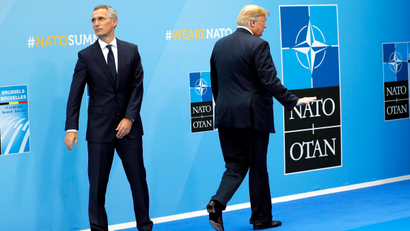 President Donald Trump gestures as he walks away after being greeted by NATO Secretary General Jens Stoltenberg, left, before a summit of heads of state and government at NATO headquarters in Brussels on Wednesday, July 11, 2018. NATO leaders gather in Brussels for a two-day summit to discuss Russia, Iraq and their mission in Afghanistan.