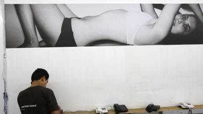 A man uses one of the phones at the American Apparel factory in downtown Los Angeles, in this October 17, 2008 file photo.