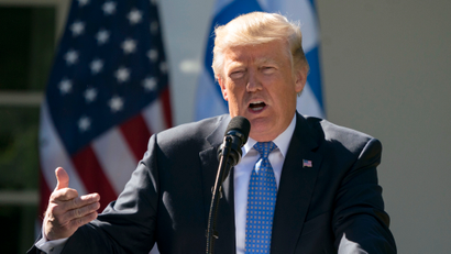 FILE - In this Oct. 17, 2017, photo, President Donald Trump speaks during a news conference in the Rose Garden of the White House in Washington. Trump says Democrats are holding up his judicial nominees, but almost nine months into his presidency he has had more judges confirmed than President Barack Obama did in the same time period. And his numbers aren’t far off those of other recent presidents. (AP Photo/Carolyn Kaster)